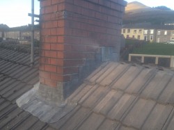 New flashings and soakers before repointing and ridgeing