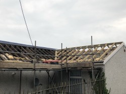 New roof fitted to replace old collapsed roof 