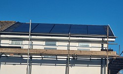 Complete slate roof with solar panel installation