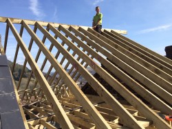 Securing the ridge board after fitting the rafters